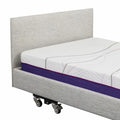 Icare Standard Headboard in light grey fabric on an iCare bed
